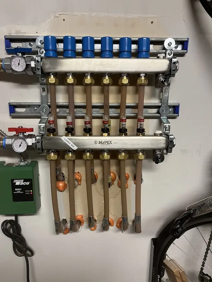 Plumber performing Water Heater Repair at a residential property in Dickinson